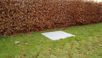 All you see of a 6 or 12 PE Sewage Treatment Station after installaion.